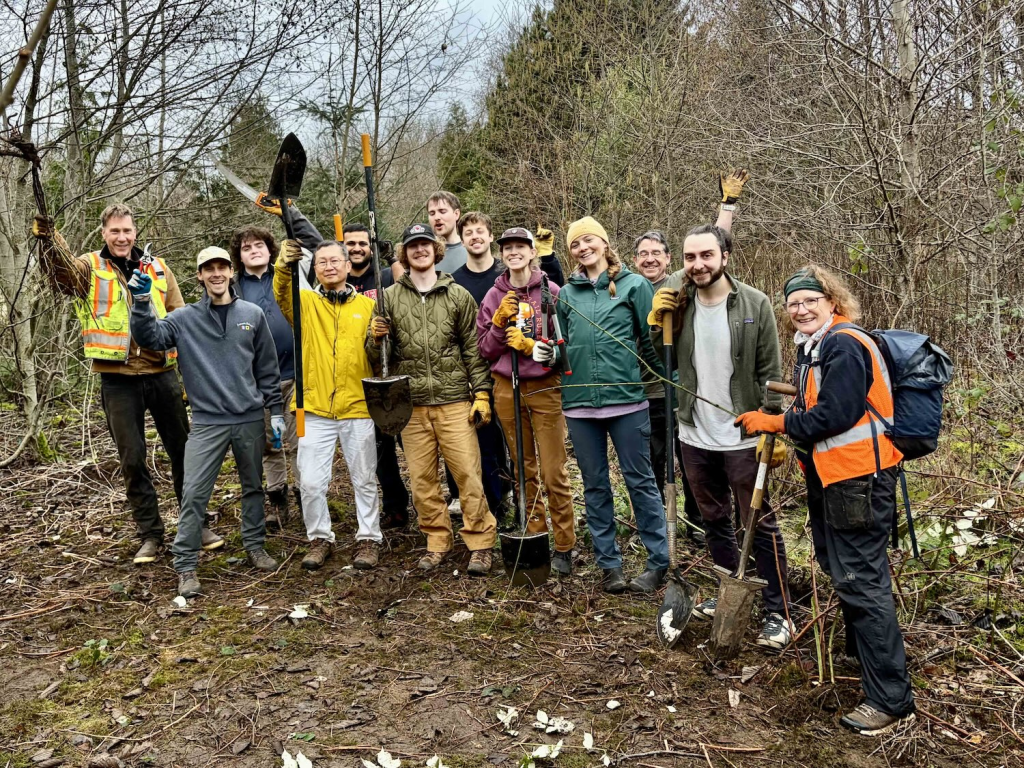 Volunteer group photo at Discovery park, with about 15 people.